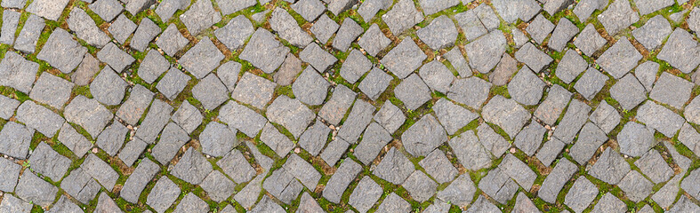texture old gray cobblestone road of a medieval town