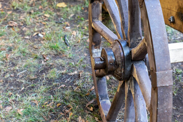 wooden large cartwheel with copy space on the background of the earth