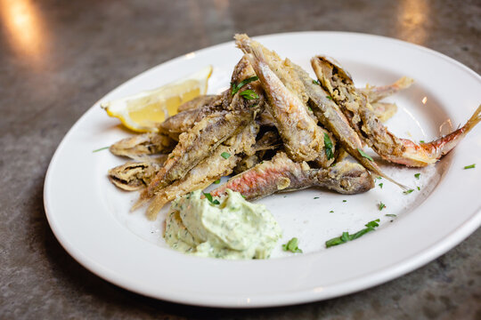 Fried fish herbs cream sauce