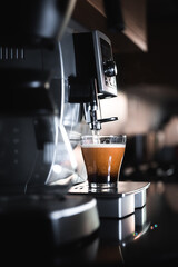 Coffee machine making latte