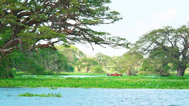 Boat with Passengers in the Shallows of Tissa Lake
