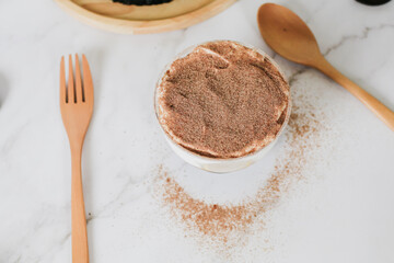 Banoffee cake with bananas, whipped cream, chocolate, caramel, coffee and toffee in cafe restaurant