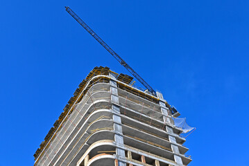 Crane and highrise construction site