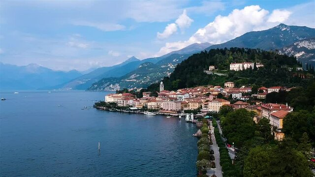 Beautiful Town situated on shore of Lake Como. Beautiful sunny day. Aerial drone wide shot.