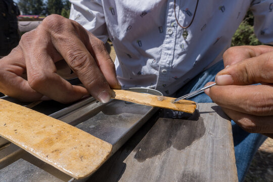Man preparing kambo amazon frog poison medicine for body detox