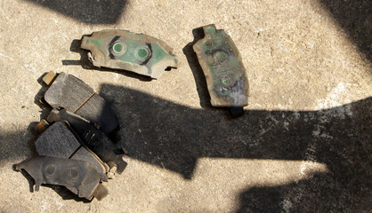 group of old used disc brake on a concrete floor after repair and replacement