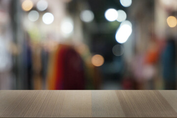 Empty dark wooden table in front of abstract blurred bokeh background of restaurant . can be used for display or montage your products.Mock up for space.