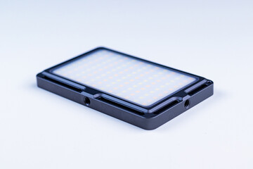 Small-sized LED lamp for photo and video production. Soft focus.
