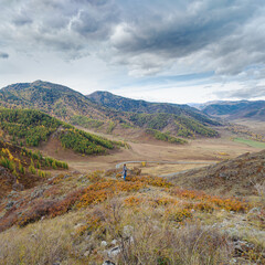 Beautiful view of Chuysky tract, Altai Republic, Russia, natural autumn landscape, colorful forest on mountain slopes