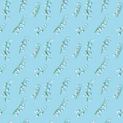 Creative pattern with spring flowers white lilies of the valley on blue. Seasonal floral design.