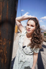 Fototapeta premium woman in alley way in green dress