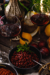 Still life in old masters style. Flowers, wine, old dishes, fruits. The concept of a richly decorated table.