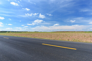 Fototapeta premium Side view of asphalt road and beautiful blue sky.