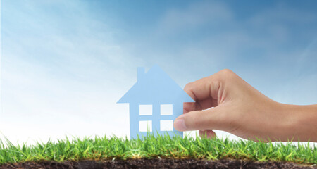 Naklejka premium Hands holding paper house, family home protecting insurance concept
