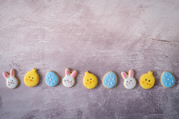 Flat Lay Line of Easter Cookies from Above with Copy Space on Light Background