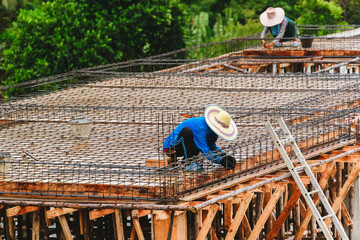 Earthquake-resistant foundation of future house. Construction work in hot asian countries. Reinforcement mesh for concrete screed