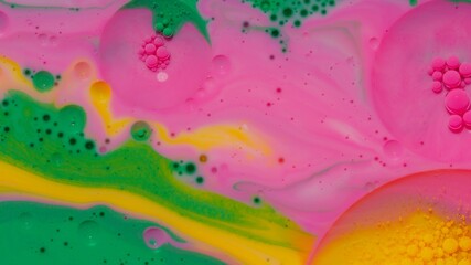 Top view fantastic structure of colorful oil paint and ink bubbles. Chaotic motion. Abstract colorful paint. Movement in liquid. Water surface multicolored texture background. Macro. Pattern, design