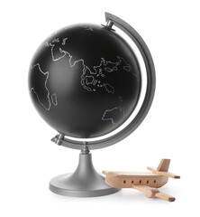 Globe with wooden airplane on white background