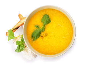 Bowl with tasty garlic cream soup on white background
