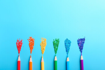 Composition with colorful pencils on color background