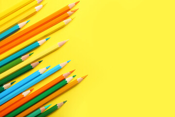 Set of colorful pencils on color background