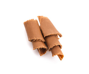 Delicious chocolate curls on white background