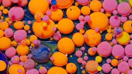 Colorful orange pink bubbles wallpaper themes background. Multicolor space universe concept....