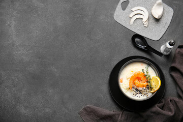 Bowl with Thai rice soup on dark background