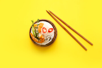 Bowl with Thai noodle soup on color background