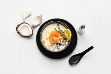 Bowl with Thai rice soup on white background