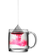 Dipping tea bag in hot water on white background
