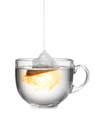 Dipping tea bag in hot water on white background