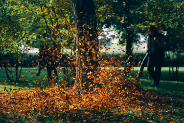 People operating a heavy duty leaf blower.