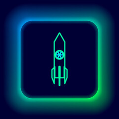 Glowing neon line Nuclear rocket icon isolated on black background. Rocket bomb flies down. Colorful outline concept. Vector