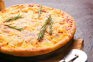 Tasty pizza on dark background