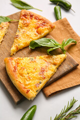Composition with tasty pizza on light background