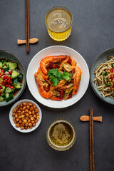A table of Chinese home cooking and beer