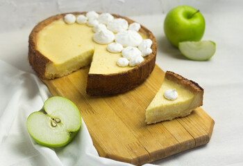 Slice of Meringue Pie. Homemade dessert Apple Tart. Piece of cake on wooden board.