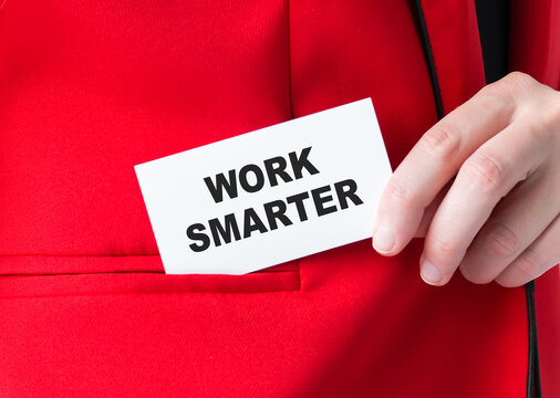 Work Smarter Not Harder Concept. woman holding a card with a motivational message text written on it and puts the card in a red jacket korman