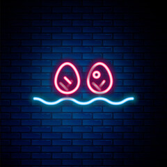 Glowing neon line Plant icon isolated on brick wall background. Colorful outline concept. Vector