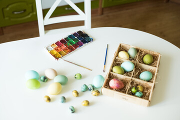 Happy Easter. Painting eggs. Paints, decorations for coloring eggs for holiday. Creative background