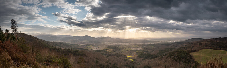 The sun shines through the clouds on the murg valley in the northern black forest