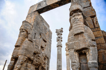 Giant statues of two lamassu creatures at the Gate of All Nations in Persepolis near Shiraz, Iran - 423653714