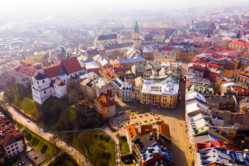 View from drone of historic center of Lublin with Old Church Square and Dominican monastery on background with Catholic Archcathedral and Trinitarian Tower at springtime, Poland