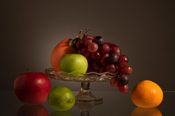 Still life with fruit on dark grey background
