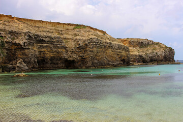 Rock by the crystal blue sea of Malta