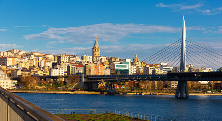 Fototapeta premium Golden Horn Halic Metro Bridge in Istanbul, Turkey against blue sky