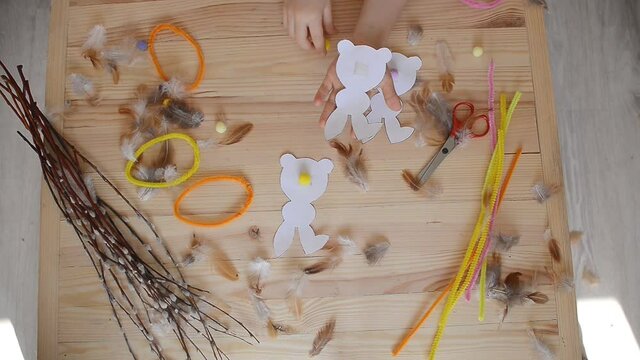 preparation for Easter. cutting hares from paper