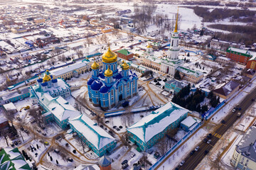 Winter view from a drone of the Nativity-Bogoroditsky monastery in the center of the city of Zadonsk surrounded ..by residential buildings, Russia