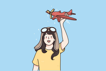 Happy childhood and games concept. Young smiling girl in goggles standing with toy plane in hands and playing imagining her pilot vector illustration 